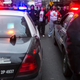 Demonstrators lock arms and block two police cruisers Dec. 21, 2014, in Cleveland. Demonstrators from Ferguson, Mo., traveled to Cleveland to unite with activists protesting the death of Tamir Rice, a 12-year-old boy who was shot and killed by Cleveland police in November.
Angelo Merendino/Getty Images